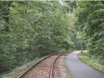 One track of the former military railway has been kept in place for the tourist railway / rail cycle operation, and the other track converted into a rail trail 